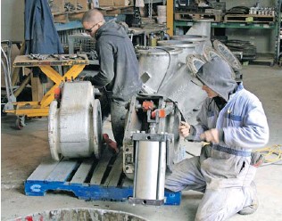 Unicast employees in Kelowna work on the company’s most popular product — the convertible diverter valve, which is used in the cement industry. The valve is easy to install and durable.